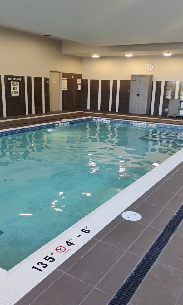 The indoor pool where Champions Swim School lessons take place, with clearly marked depths